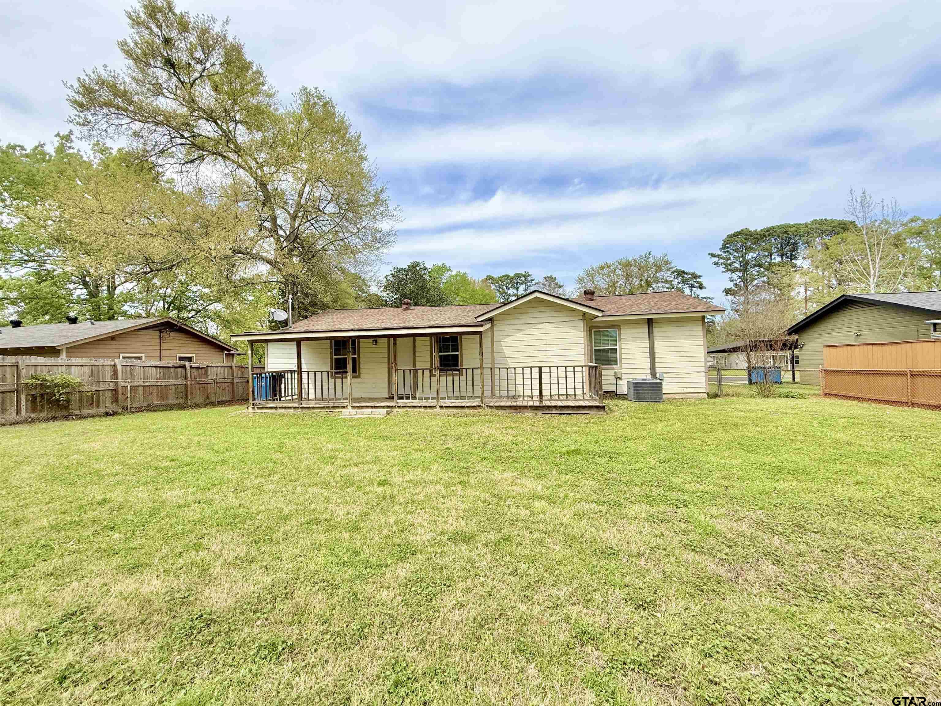 404 Beckley Street Kilgore, TX 75662 - Photo 17 of 20 a front view of a house with a garden