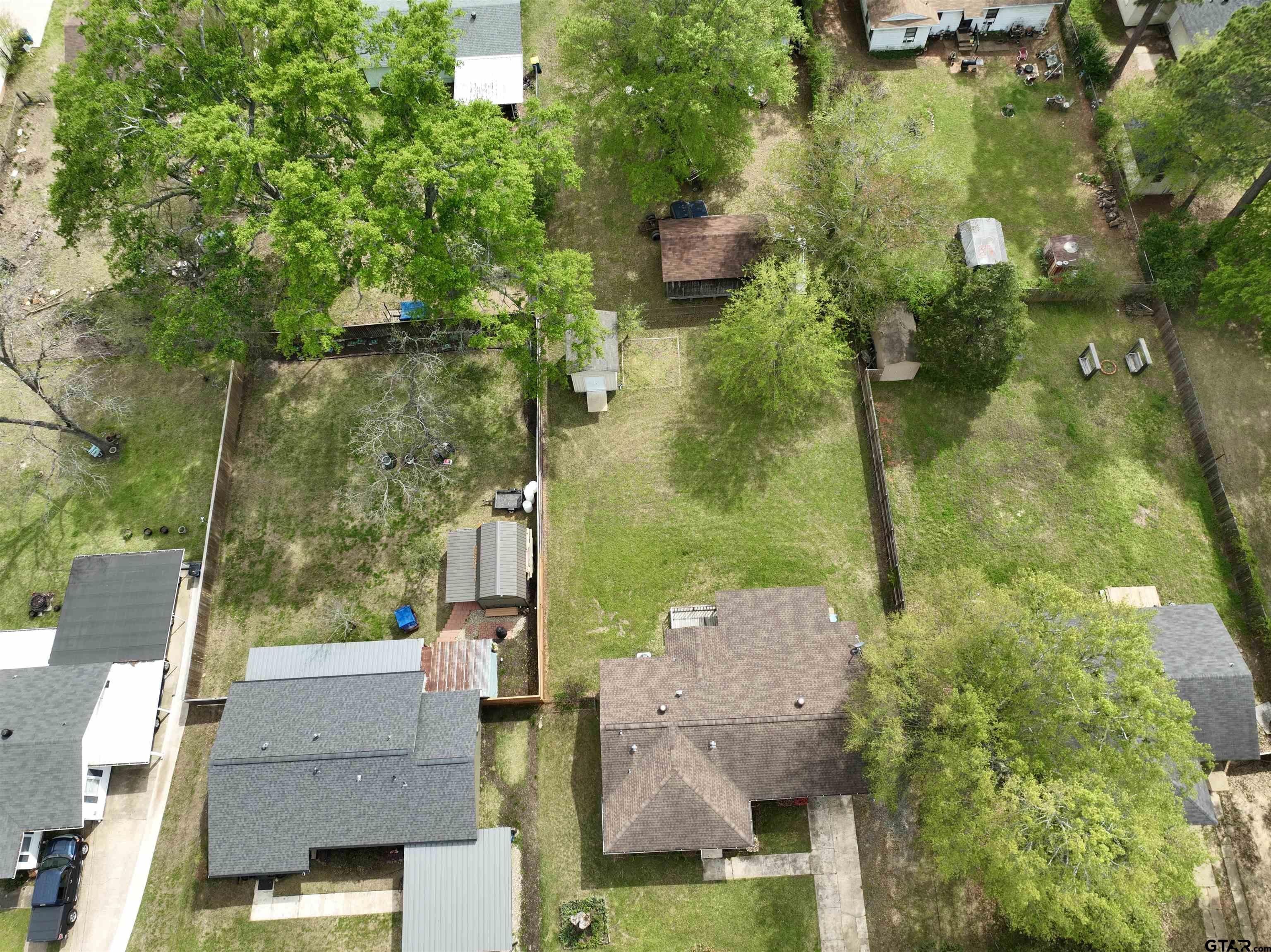 404 Beckley Street Kilgore, TX 75662 - Photo 19 of 20 an aerial view of residential houses with outdoor space and trees