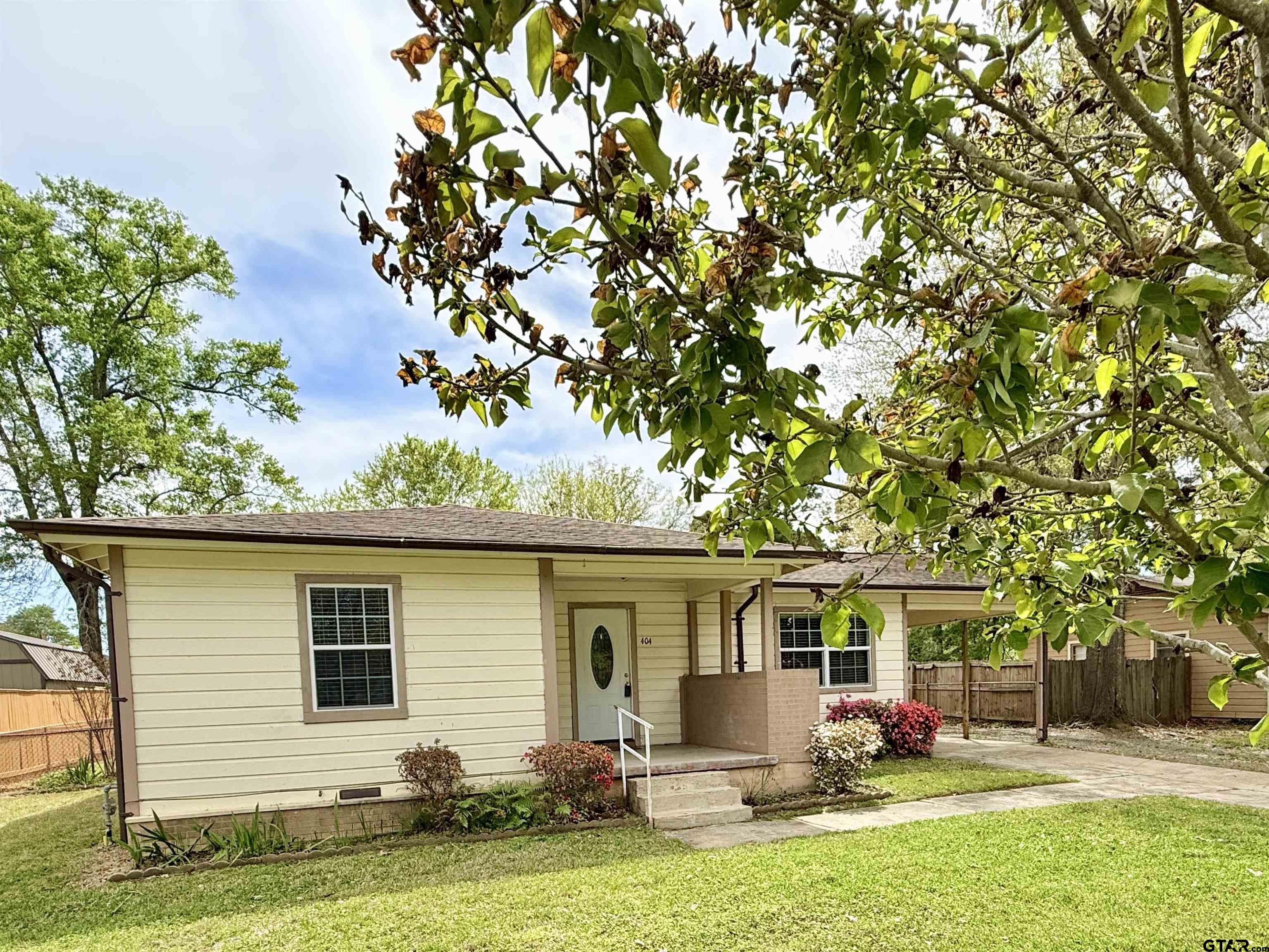 404 Beckley Street Kilgore, TX 75662 - Photo 2 of 20 a front view of a house with a yard