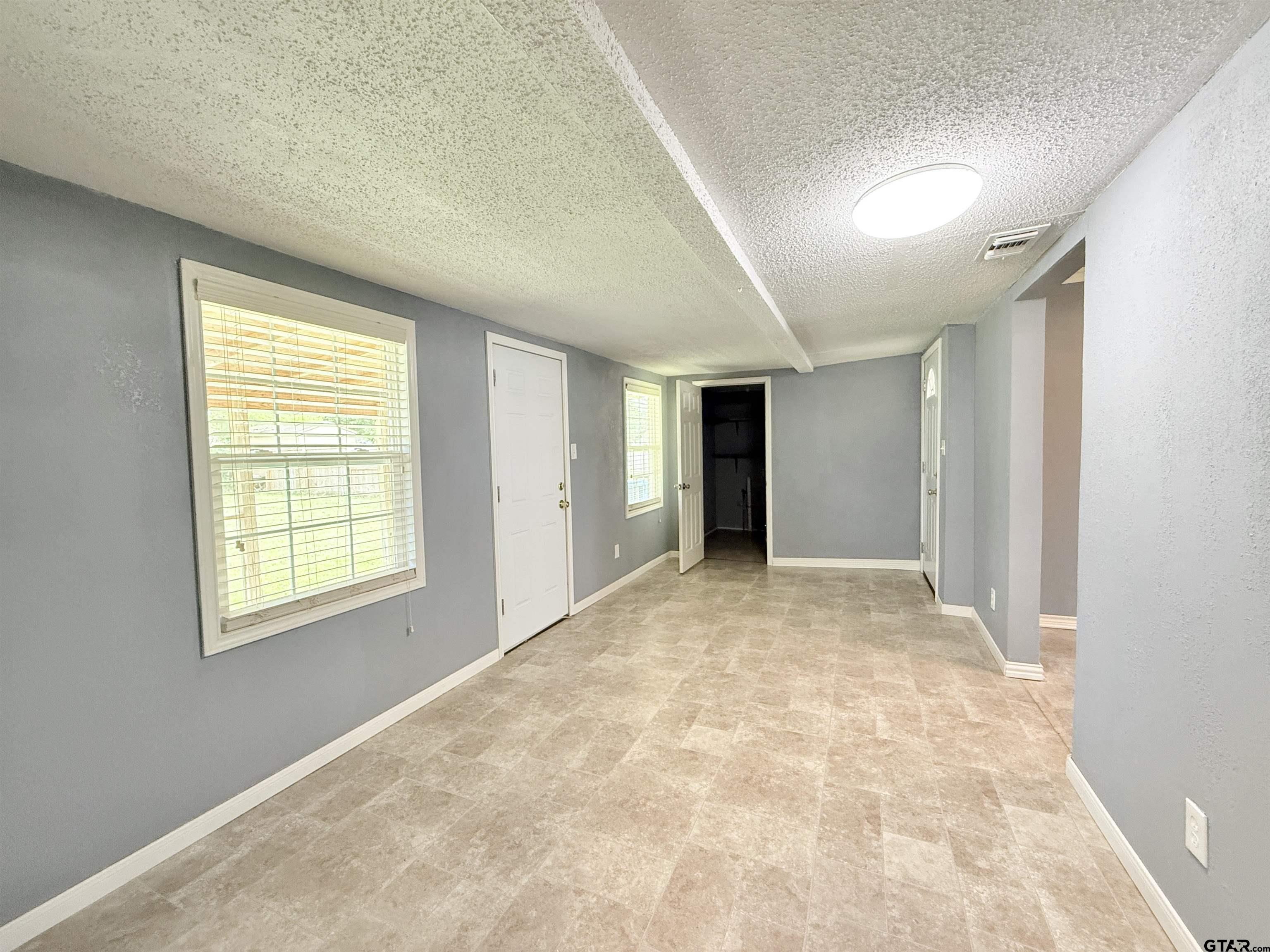 404 Beckley Street Kilgore, TX 75662 - Photo 3 of 20 a view of an empty room with a window