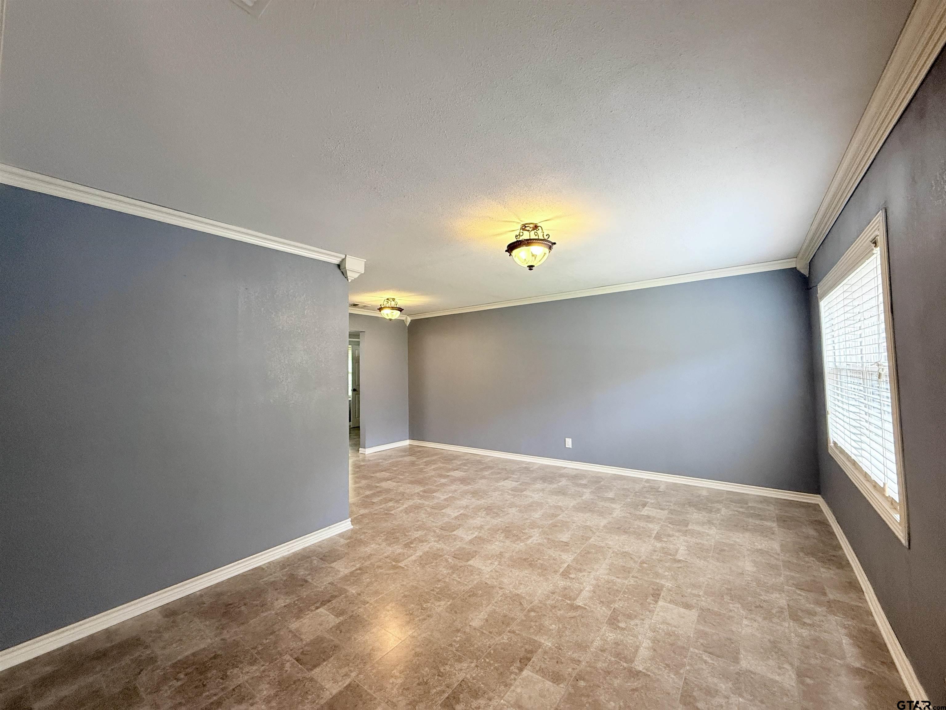 404 Beckley Street Kilgore, TX 75662 - Photo 4 of 20 a view of an empty room with a window
