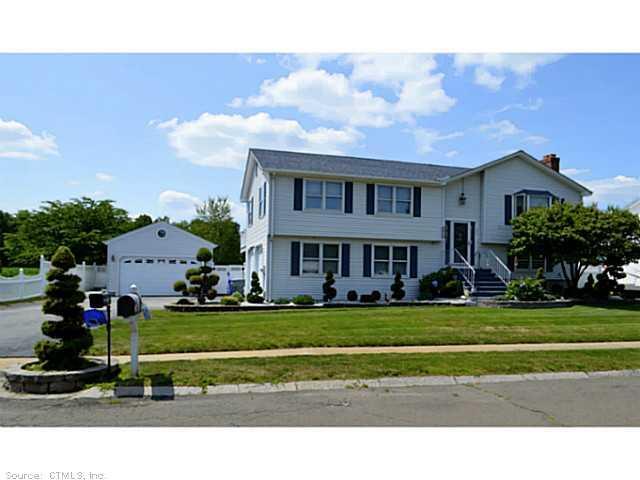 46 Spruceland Road Enfield, CT 06082 - Photo 1 of 1 a view front of houses with yard and green space