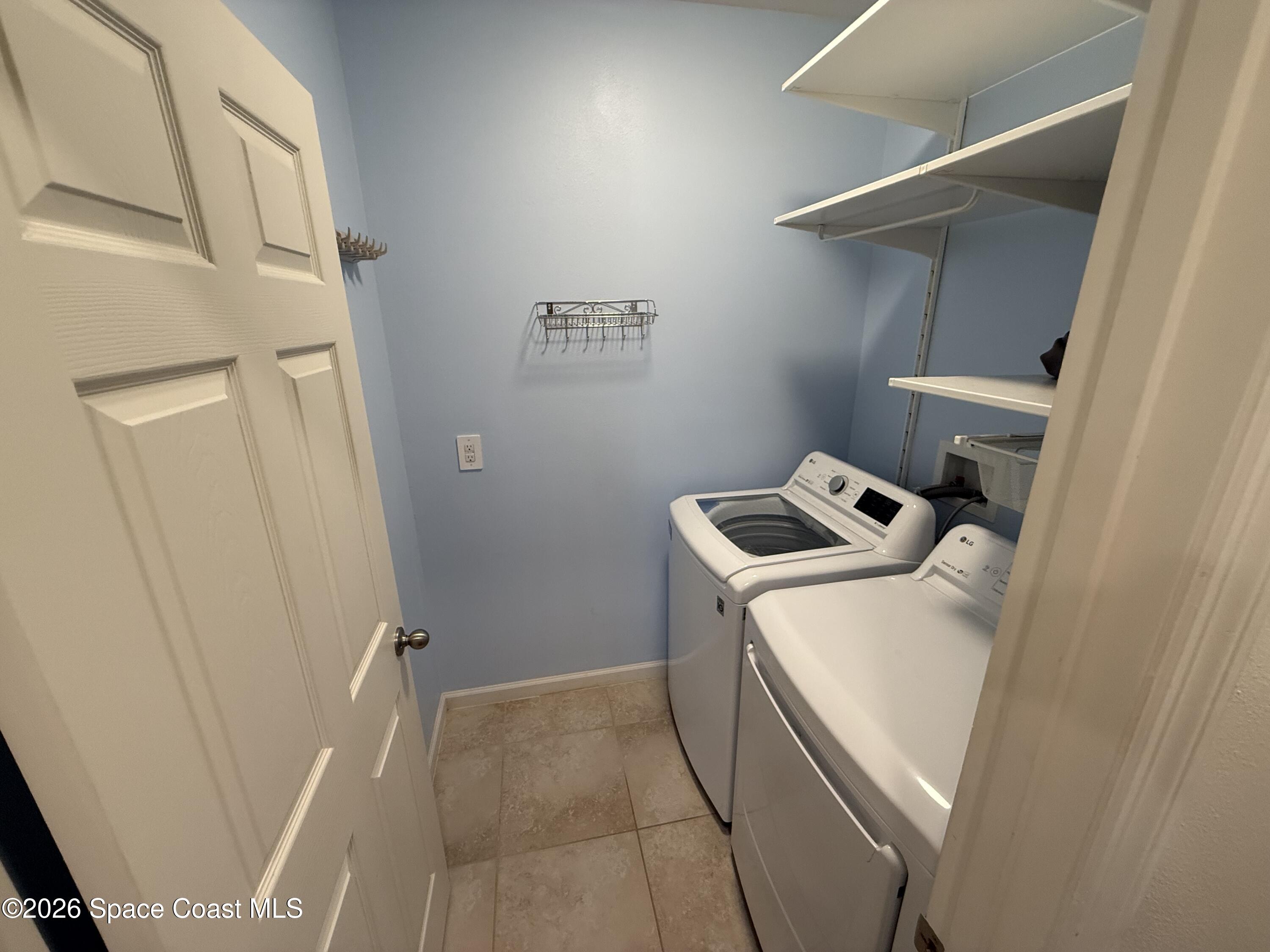 1070 Swiss Pointe Lane Rockledge, FL 32955 - Photo 10 of 18 a utility room with dryer and washer