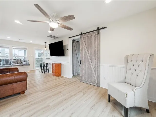 a kitchen with stainless steel appliances granite countertop a sink refrigerator and microwave