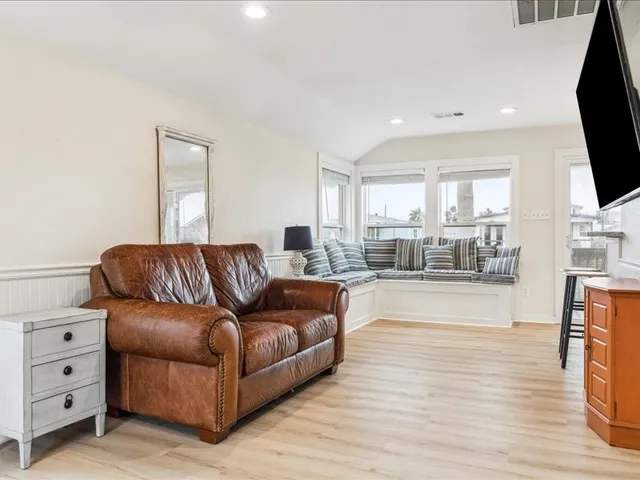 a kitchen with a refrigerator sink and stove