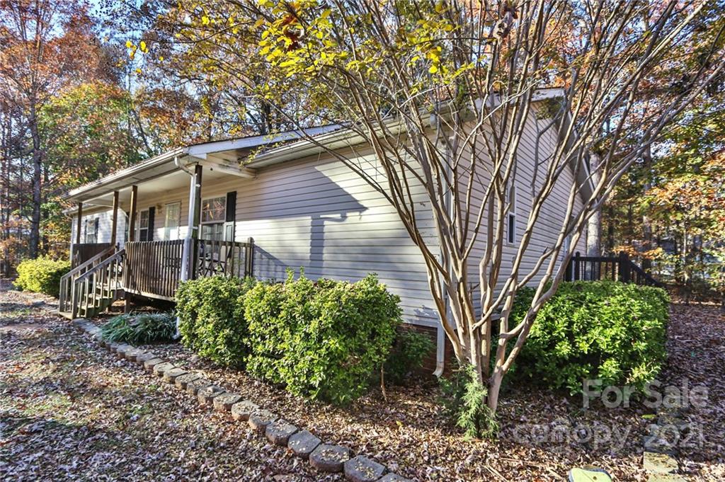 117 Valley Springs Road Olin, NC 28660 - Photo 2 of 38 a backyard of a house with lots of green space