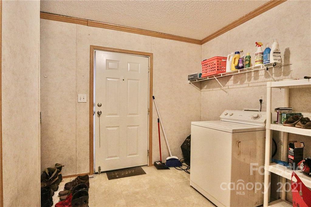 117 Valley Springs Road Olin, NC 28660 - Photo 34 of 38 a room with storage and utility