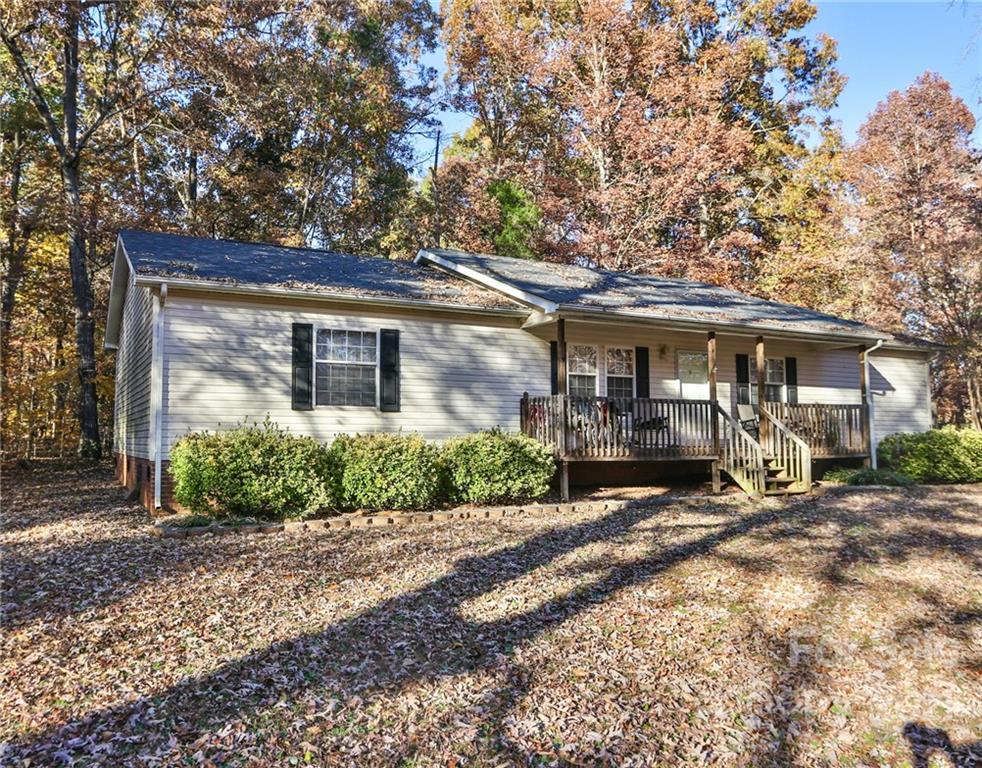 117 Valley Springs Road Olin, NC 28660 - Photo 37 of 38 a front view of a house with garden