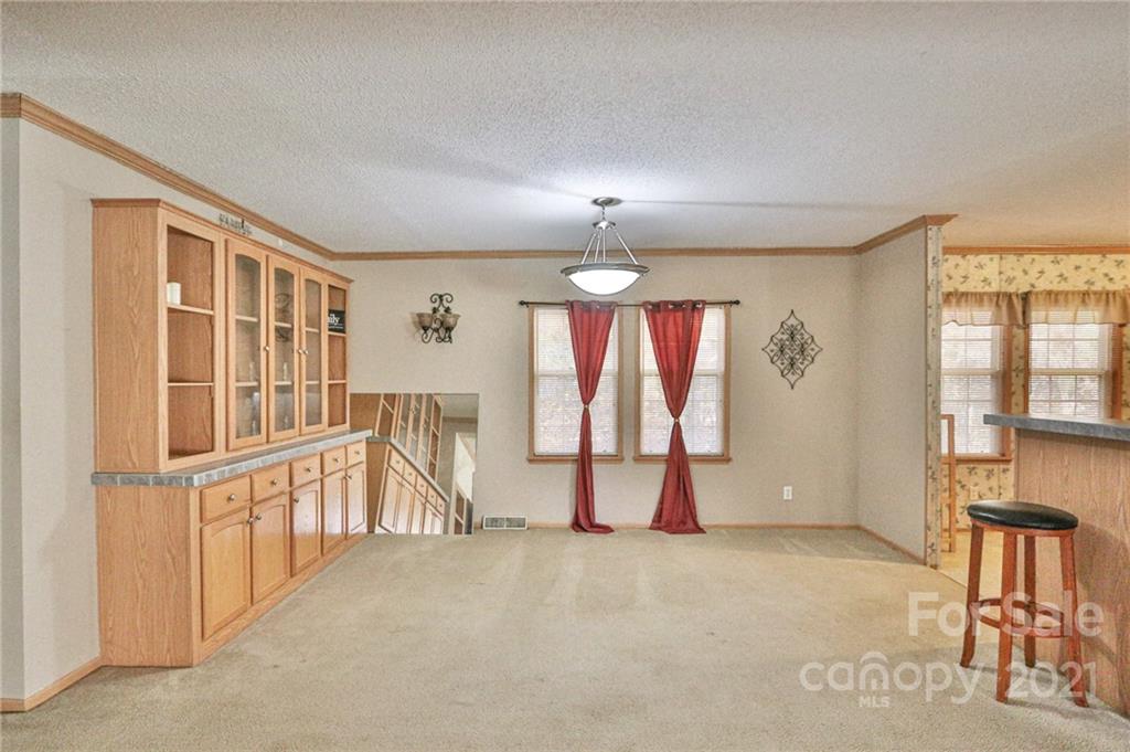 117 Valley Springs Road Olin, NC 28660 - Photo 7 of 38 a view of livingroom with hardwood floor and windows