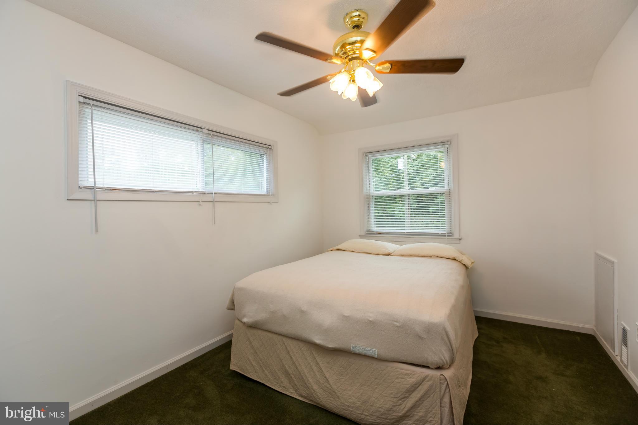 4424 Scotia Road Baltimore, MD 21227 - Photo 14 of 26 a bedroom with a bed and a window