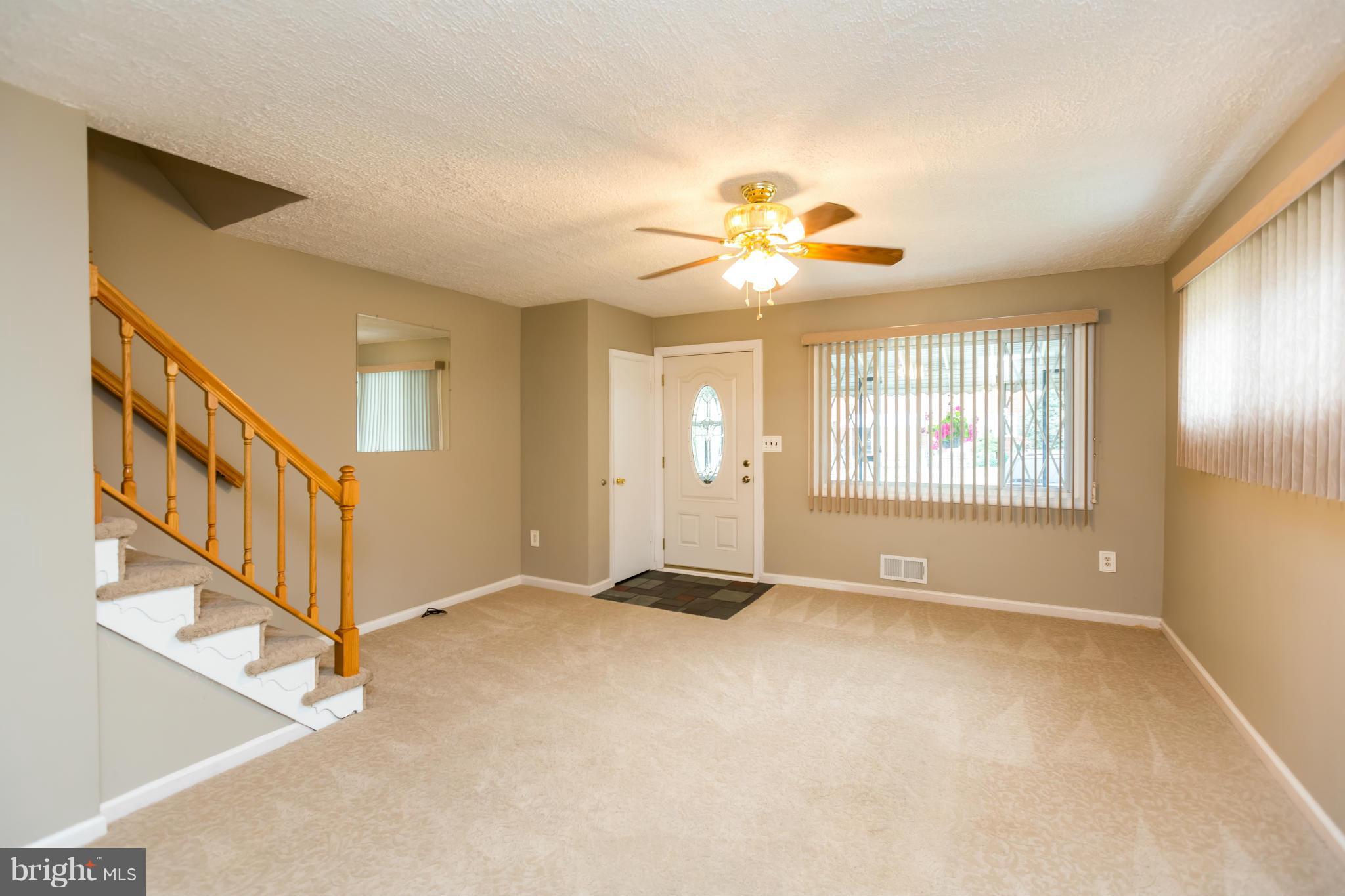 4424 Scotia Road Baltimore, MD 21227 - Photo 3 of 26 a view of an empty room with a window