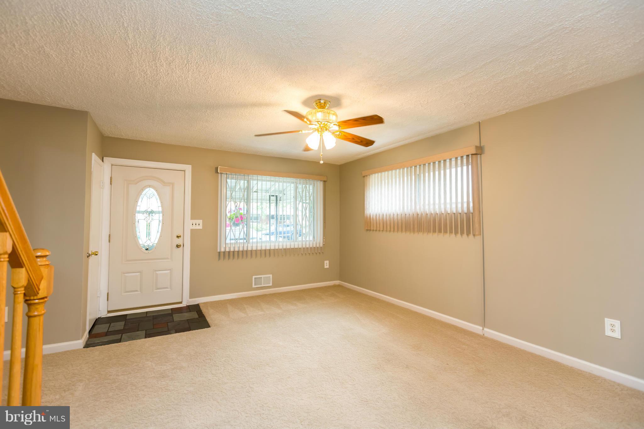 4424 Scotia Road Baltimore, MD 21227 - Photo 4 of 26 a view of an empty room with a window