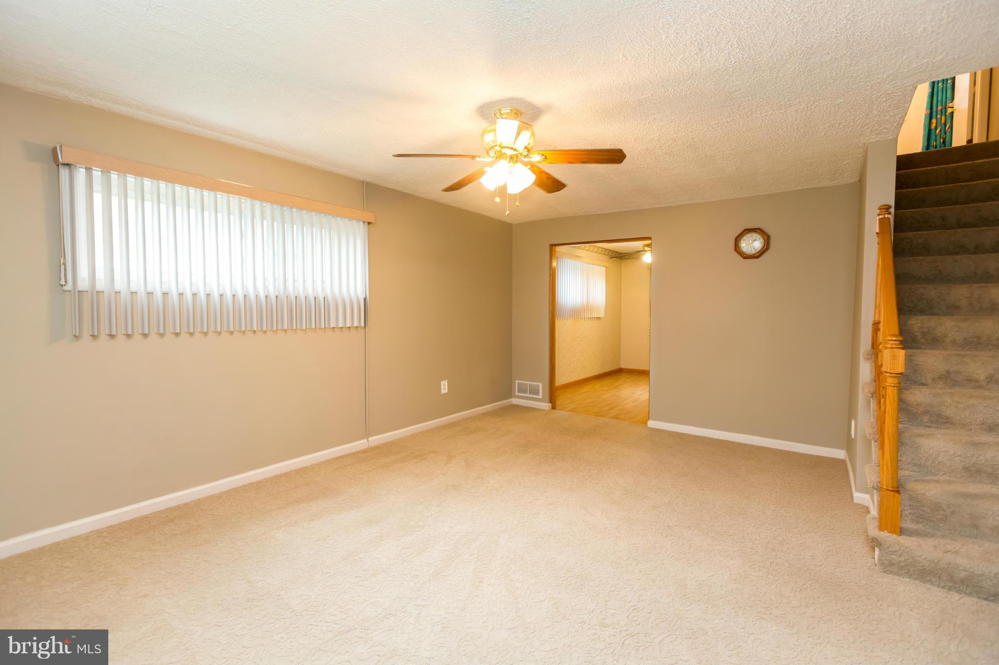4424 Scotia Road Baltimore, MD 21227 - Photo 5 of 26 a view of an empty room with a window