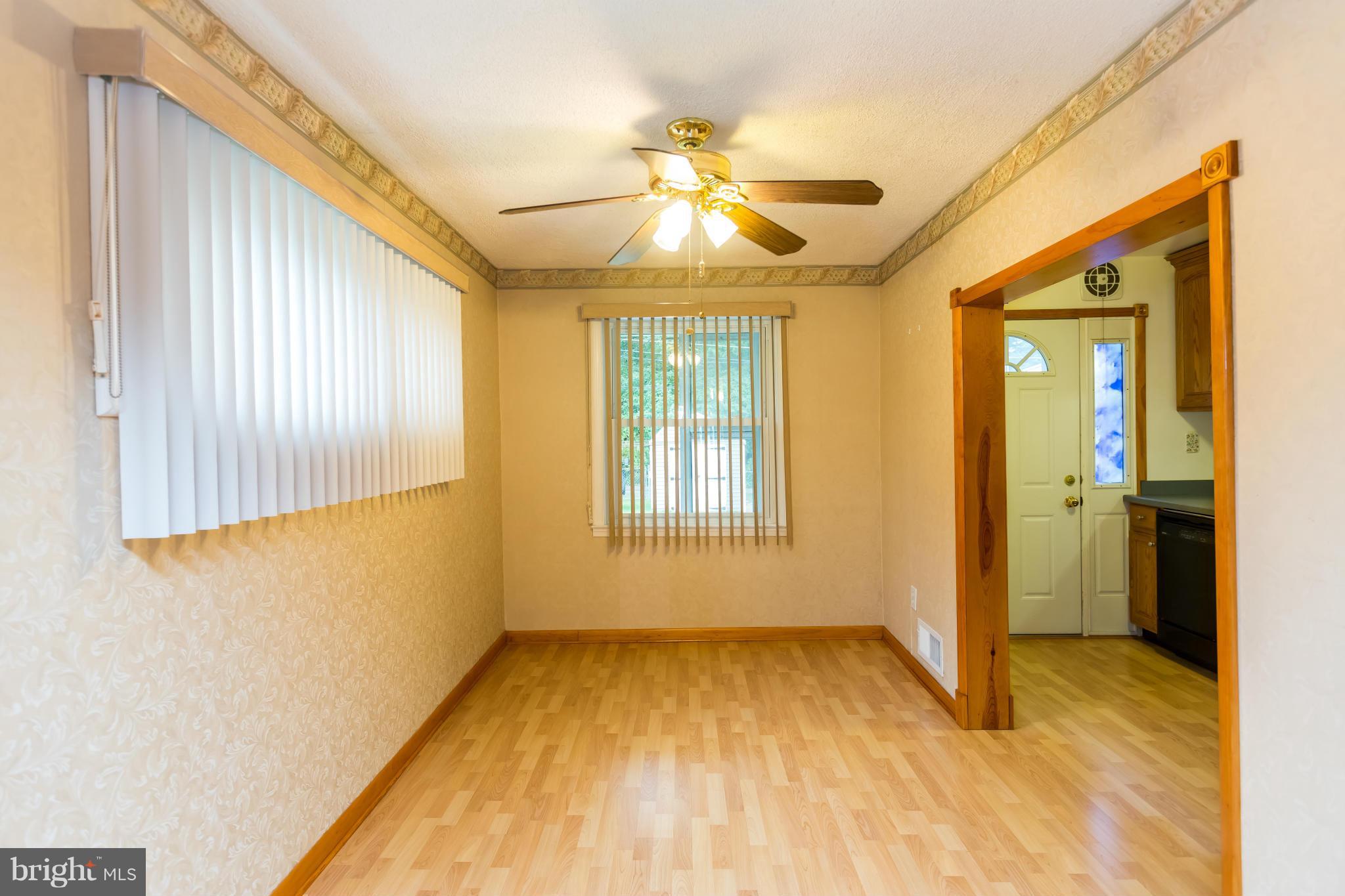 4424 Scotia Road Baltimore, MD 21227 - Photo 7 of 26 a view of an empty room with a window