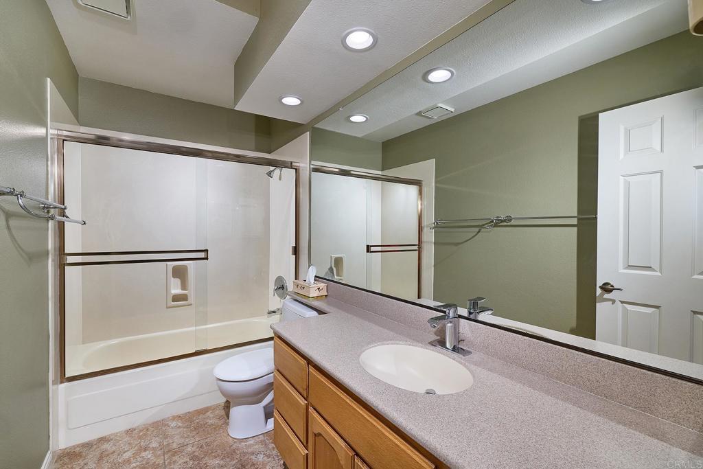 932 Alyssum Road Carlsbad, CA 92011 - Photo 17 of 31 a bathroom with a sink toilet and shower