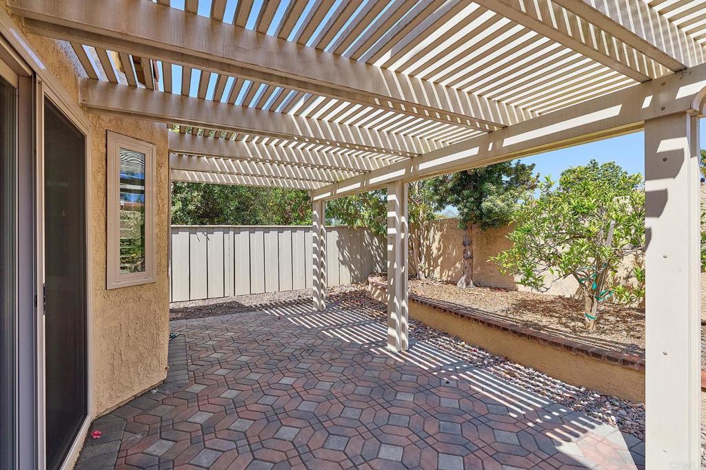 932 Alyssum Road Carlsbad, CA 92011 - Photo 19 of 31 a view of a porch with furniture and floor to ceiling window