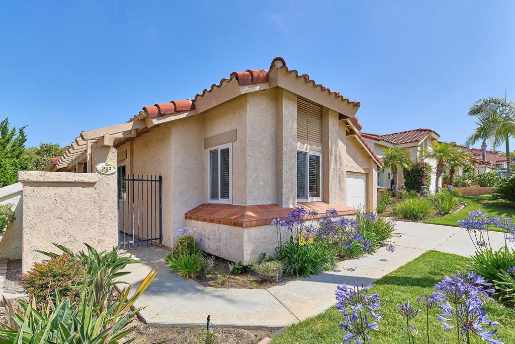 932 Alyssum Road Carlsbad, CA 92011 - Photo 2 of 31 a front view of a house with a yard