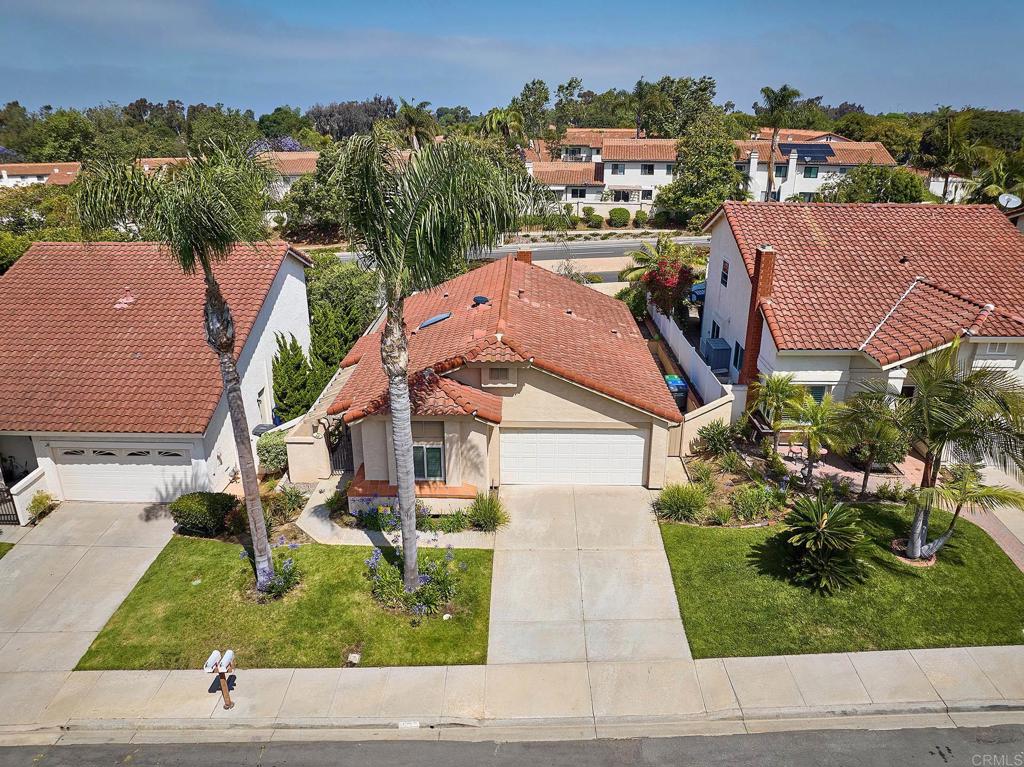 932 Alyssum Road Carlsbad, CA 92011 - Photo 21 of 31 an aerial view of multiple houses with a yard