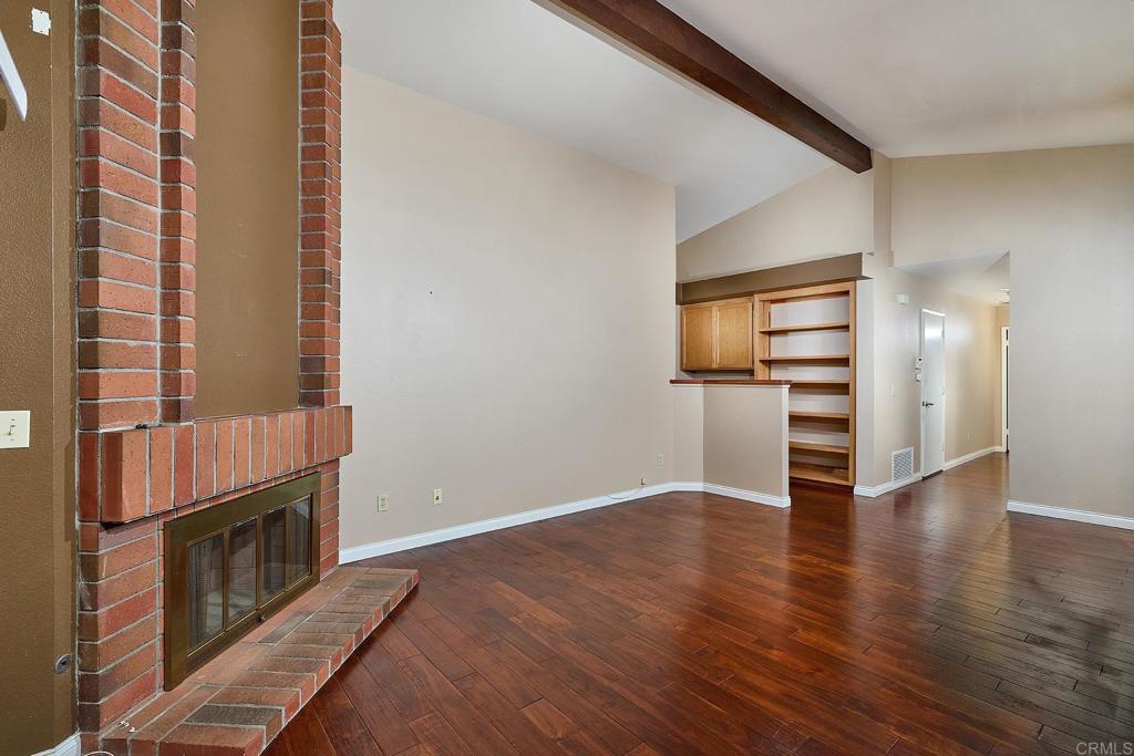 932 Alyssum Road Carlsbad, CA 92011 - Photo 3 of 31 wooden floor in an empty room with a window
