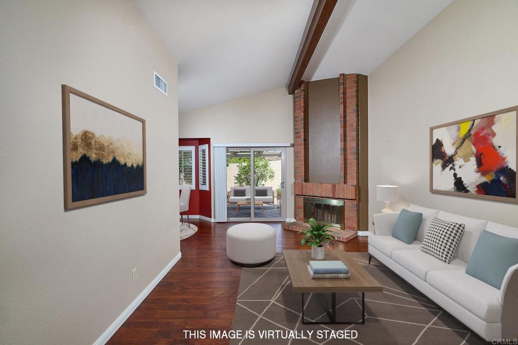 932 Alyssum Road Carlsbad, CA 92011 - Photo 5 of 31 a living room with furniture rug and wooden floor