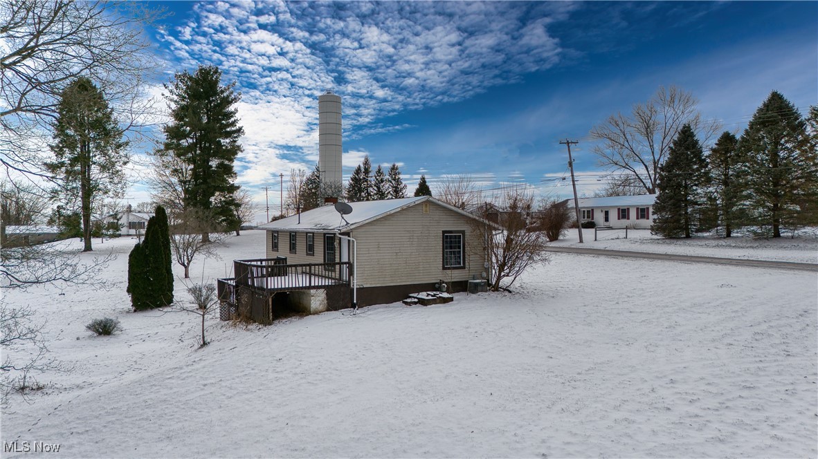 6160 Dresden Road Zanesville, OH 43701 - Photo 31 of 32 Snow covered property with a deck and a chimney