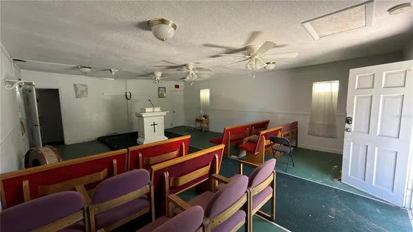 a group of people sitting on a room