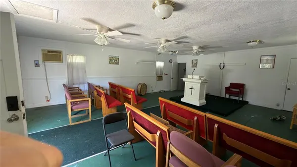 a living room with lots of furniture and a chandelier