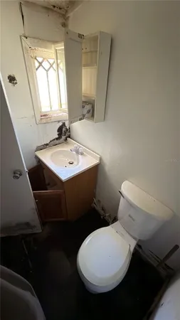 a view of hallway that has a table and couch