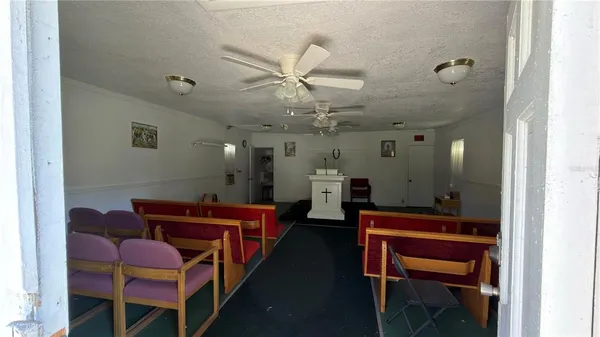 a group of chairs sitting in a kitchen next to a window