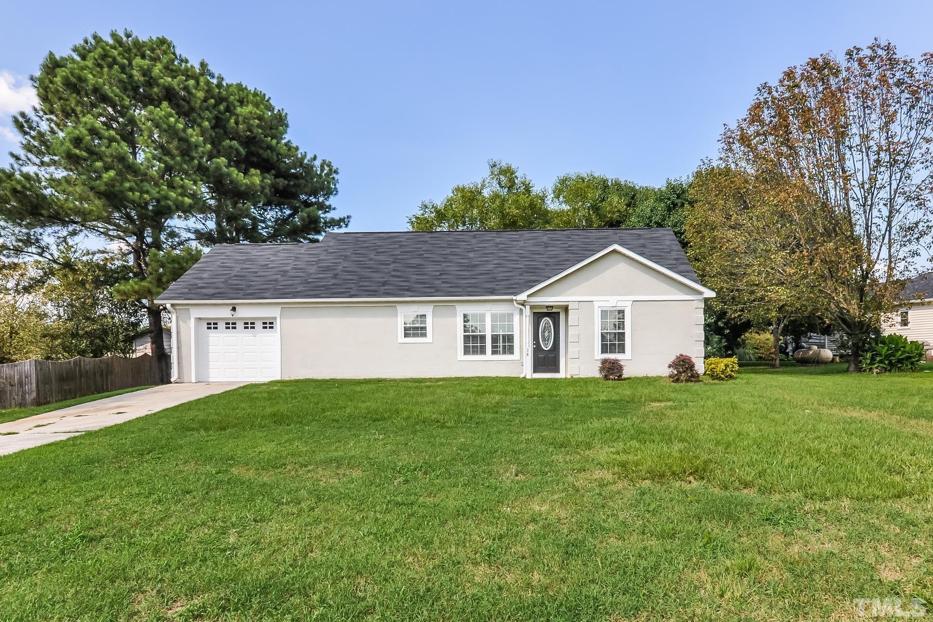 38 Greene Court Angier, NC 27501 - Photo 1 of 16 a front view of a house with yard