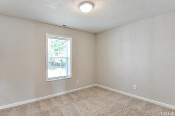 a bathroom with a sink vanity mirror and toilet