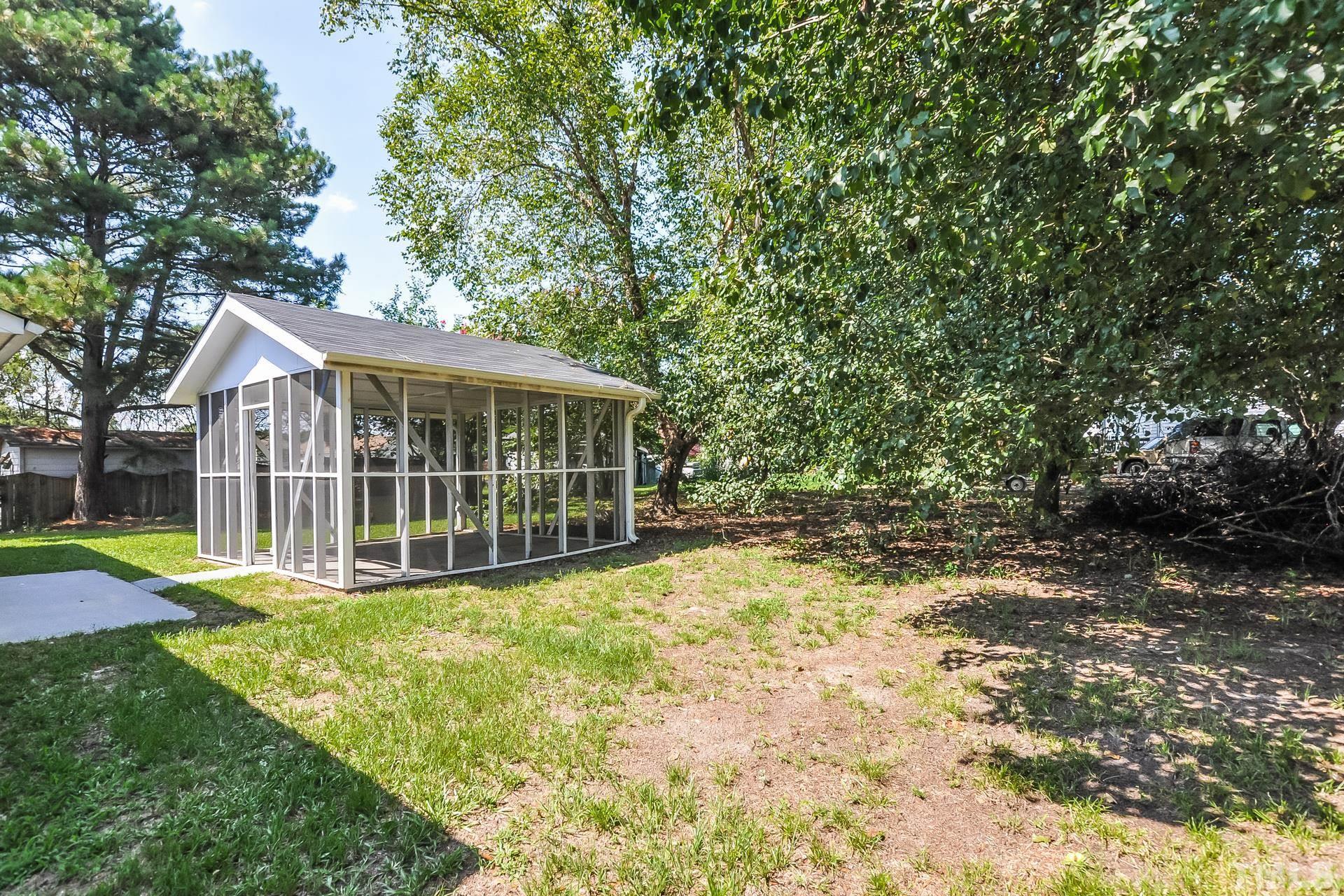 38 Greene Court Angier, NC 27501 - Photo 16 of 16 a view of a house with a yard and sitting area