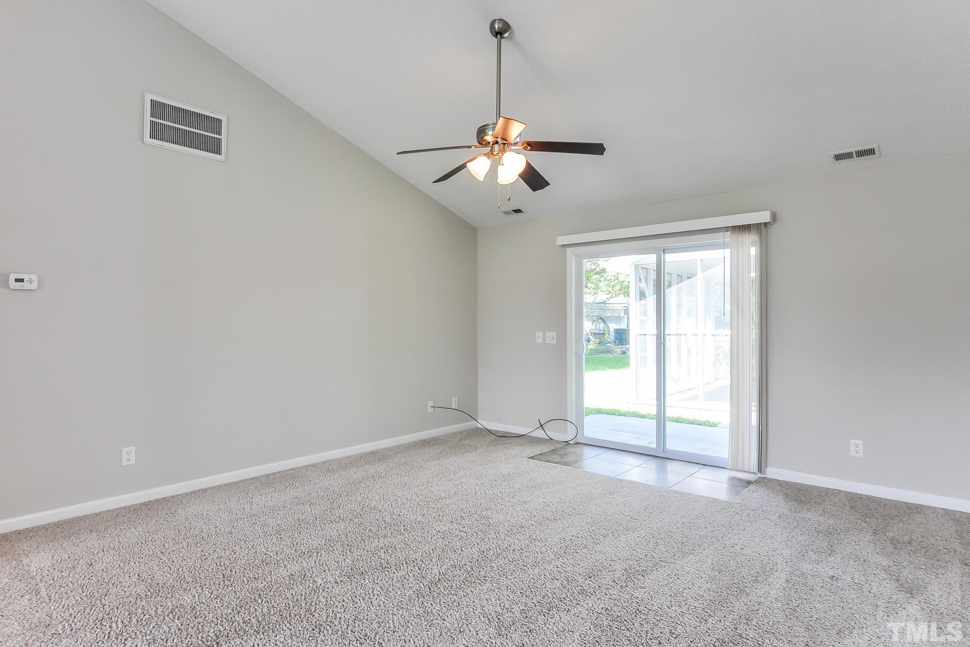 38 Greene Court Angier, NC 27501 - Photo 3 of 16 a view of an empty room with a window