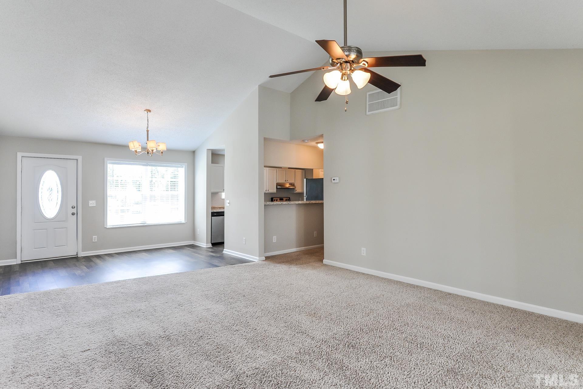 38 Greene Court Angier, NC 27501 - Photo 4 of 16 an empty room with fan and windows