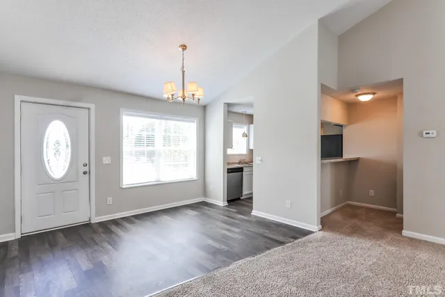 a kitchen with a sink stove and refrigerator
