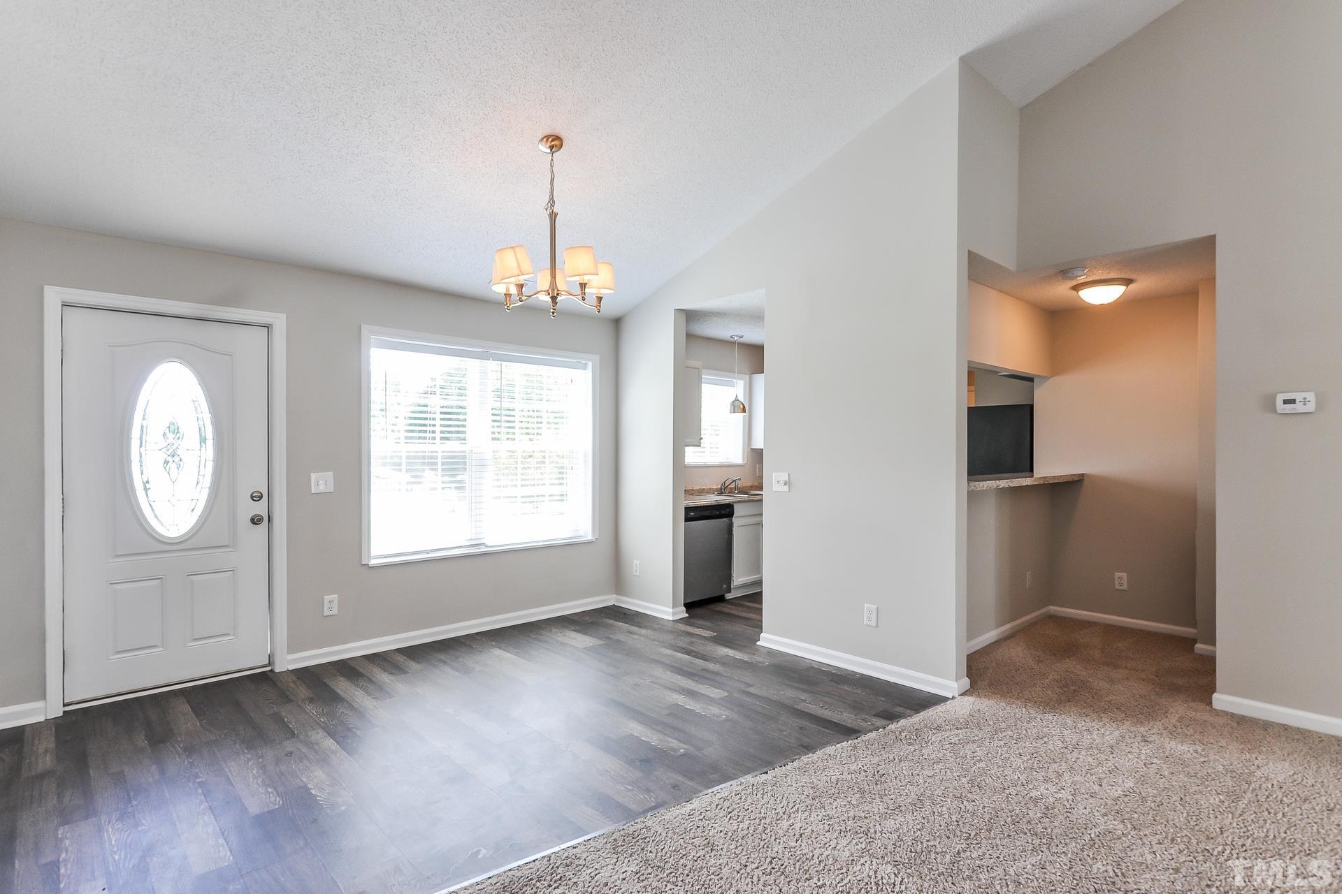38 Greene Court Angier, NC 27501 - Photo 5 of 16 a view of an empty room with wooden floor and window
