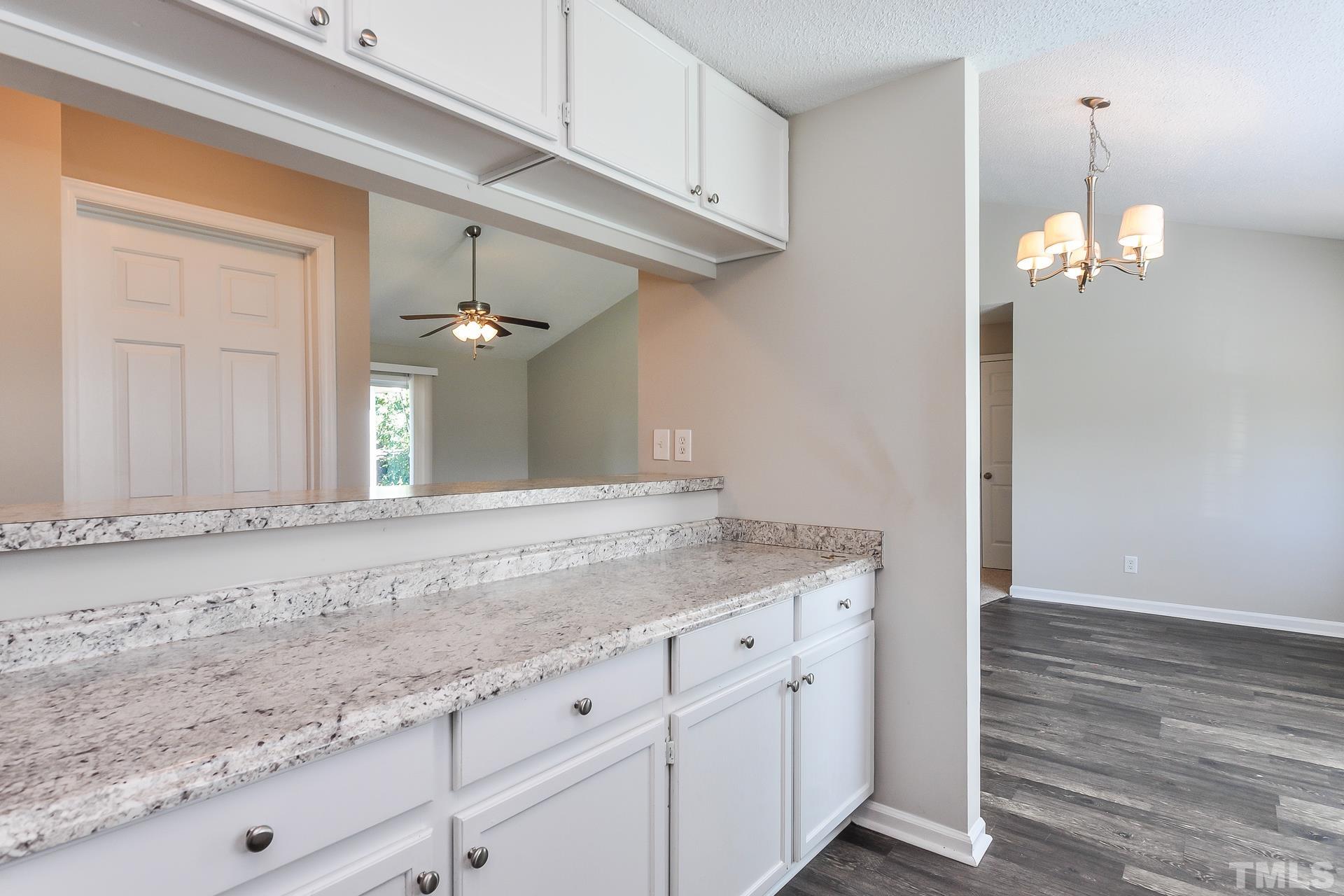 38 Greene Court Angier, NC 27501 - Photo 7 of 16 a view of a kitchen with granite countertop cabinets