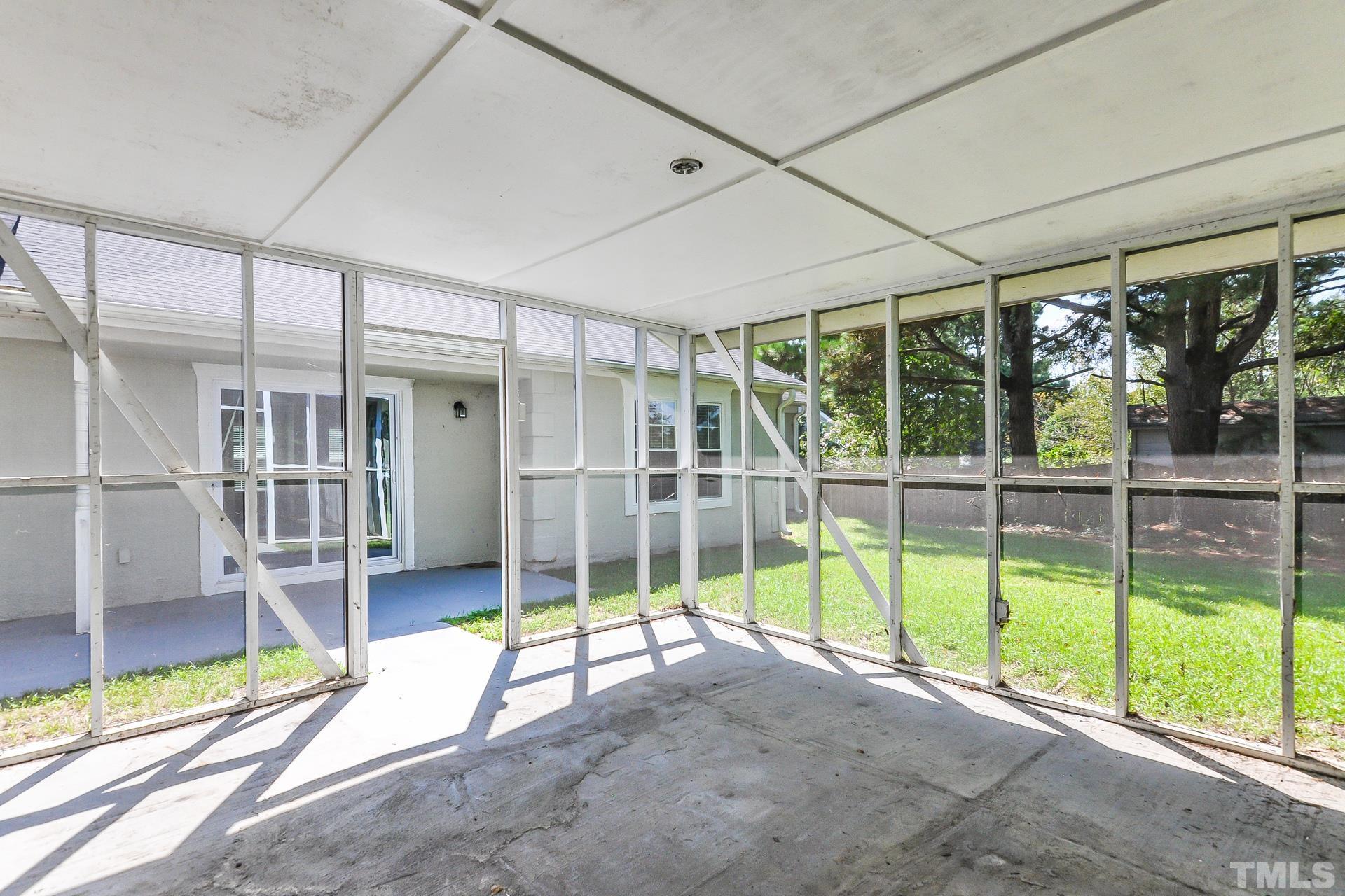 38 Greene Court Angier, NC 27501 - Photo 8 of 16 a view of an empty room with wooden floor and windows
