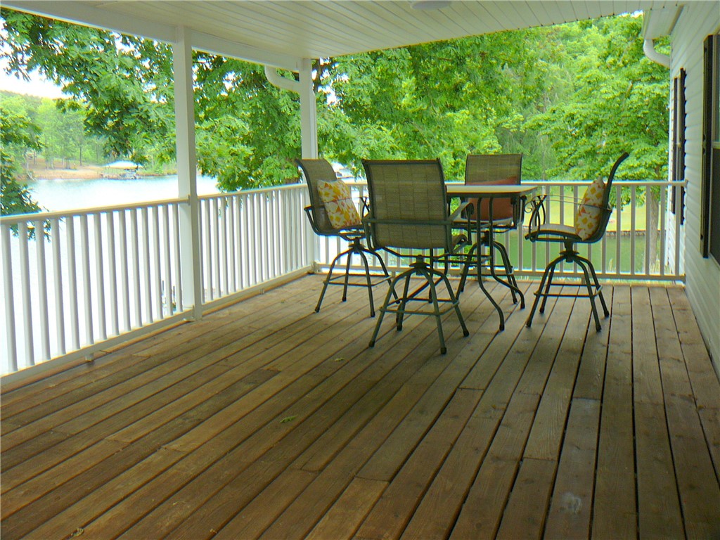 34 Owens Point Road Abbeville, SC 29620 - Photo 11 of 22 This inviting patio provides serene lake views, perfect for outdoor relaxation.