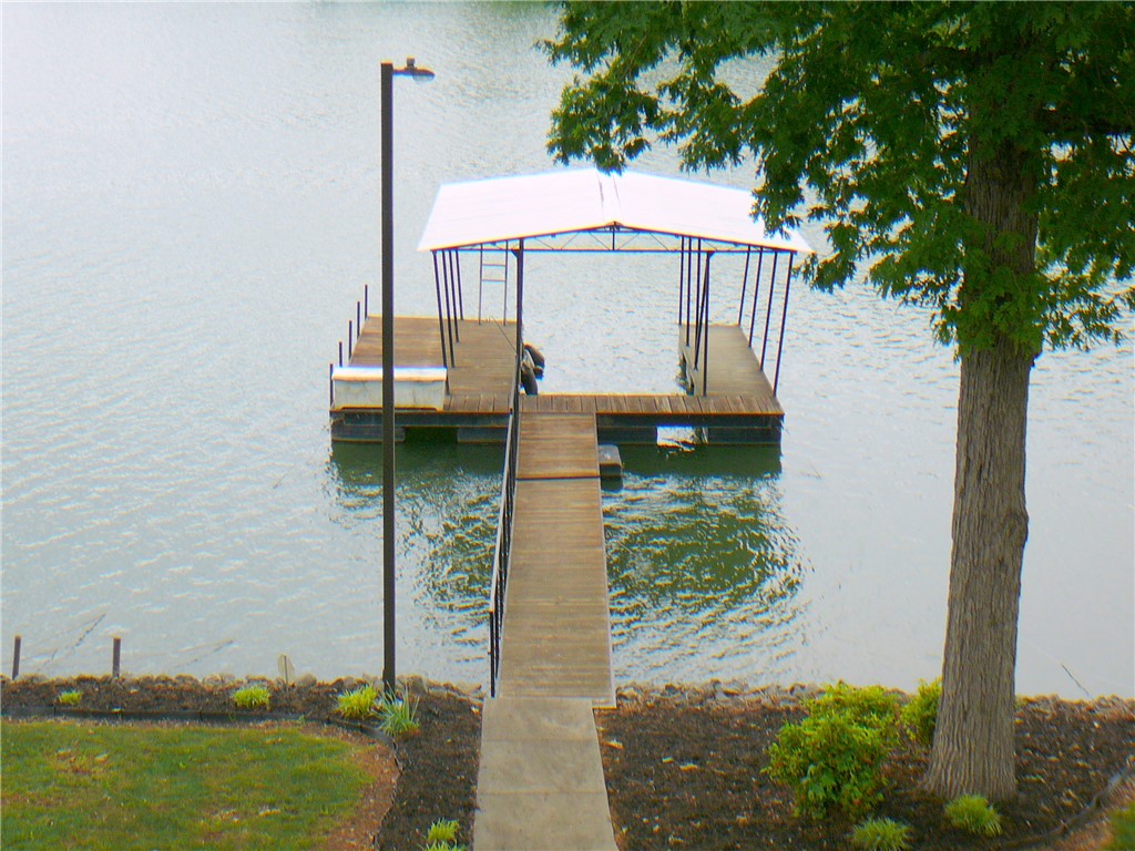 34 Owens Point Road Abbeville, SC 29620 - Photo 12 of 22 This serene waterfront property offers direct access to the lake with a private boat dock.
