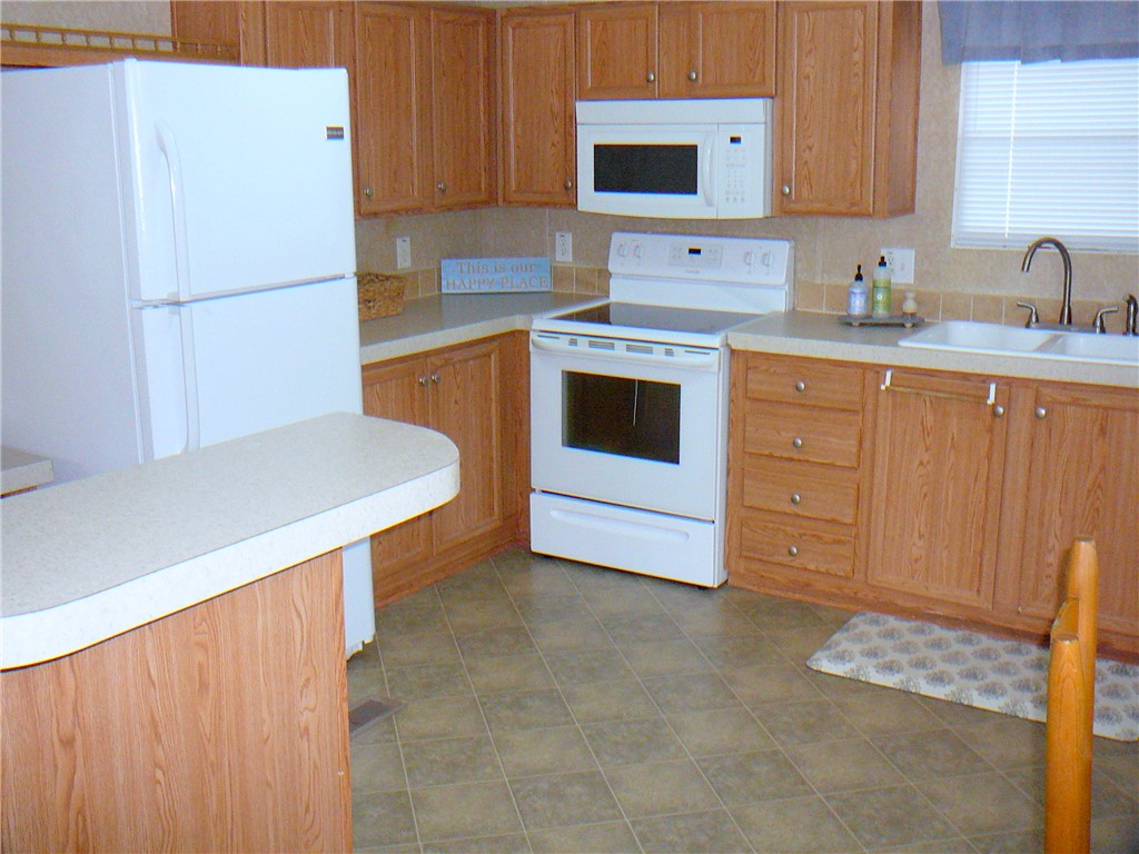 34 Owens Point Road Abbeville, SC 29620 - Photo 14 of 22 This functional kitchen provides a practical and inviting space for daily living.