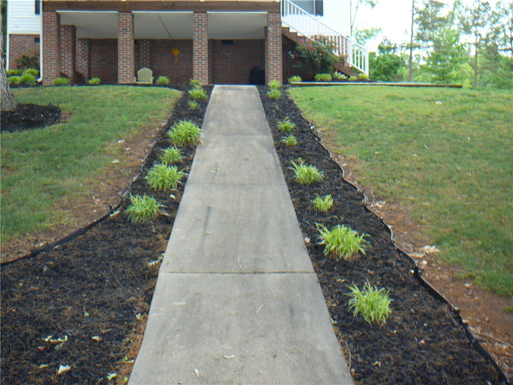 34 Owens Point Road Abbeville, SC 29620 - Photo 8 of 22 This residence features a welcoming front exterior with well-maintained landscaping.