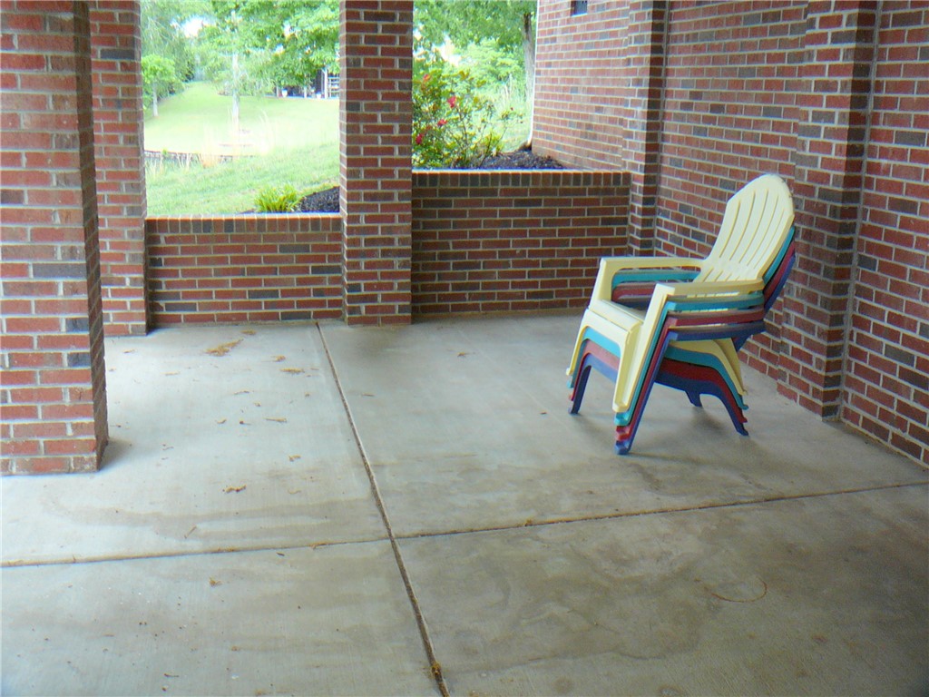 34 Owens Point Road Abbeville, SC 29620 - Photo 10 of 22 This inviting patio area offers ample space for outdoor enjoyment.