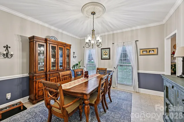 a view of a dining room with furniture and window
