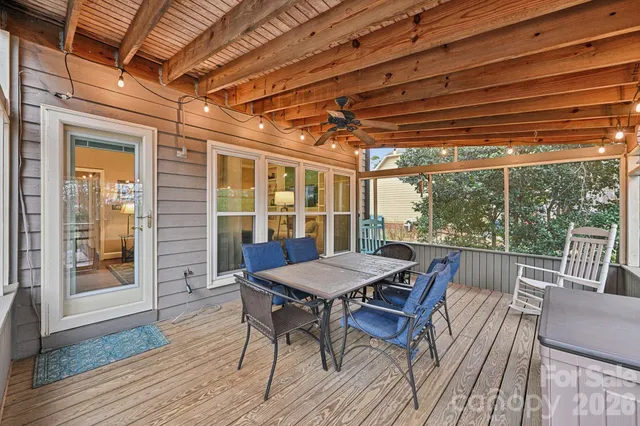 a view of a patio with a table and chairs