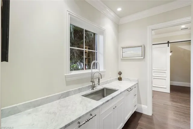 a kitchen with a sink and a refrigerator