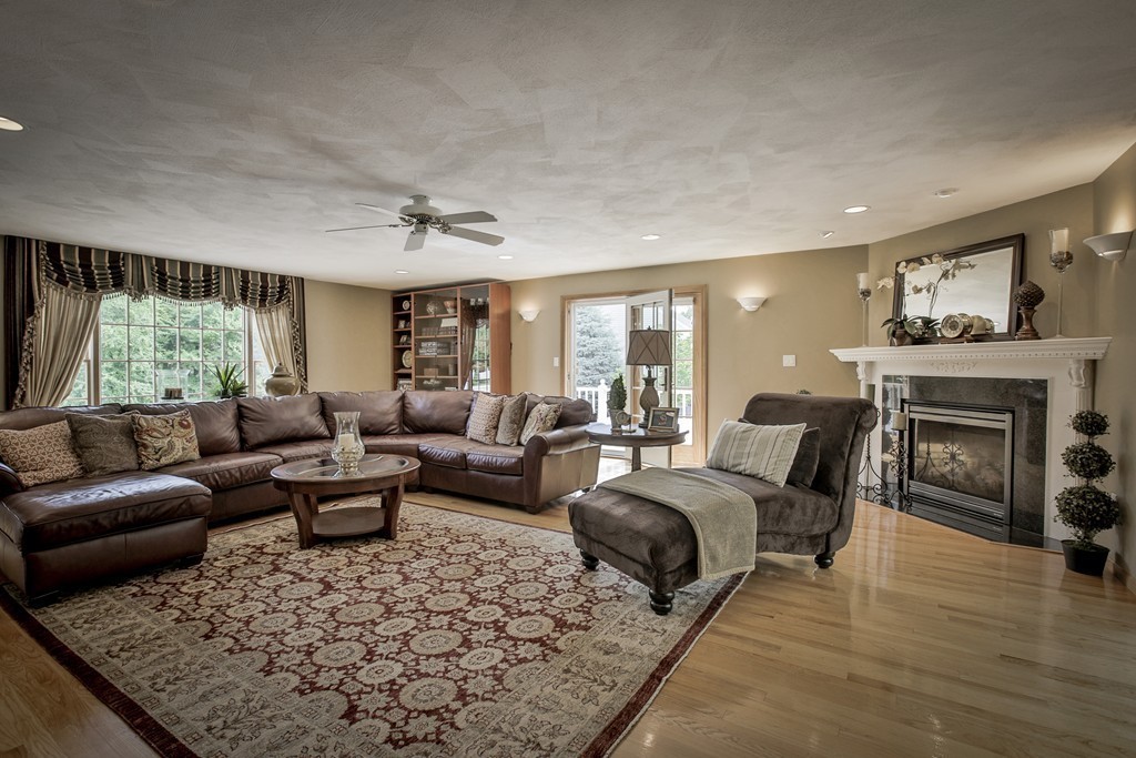 10 Hammersmith Drive Saugus, MA 01906 - Photo 17 of 30 a living room with furniture a fireplace and a large window