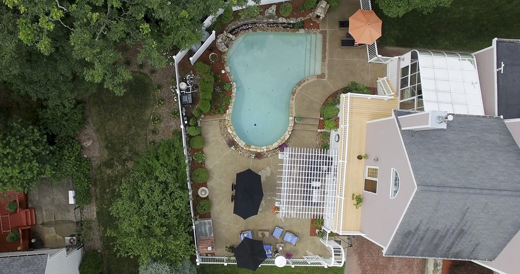 10 Hammersmith Drive Saugus, MA 01906 - Photo 6 of 30 an aerial view of a house with outdoor space and trees all around