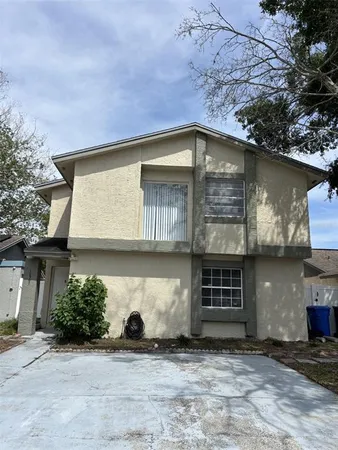 a front view of a house with a garage