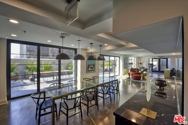 a view of a dining room with furniture window and outside view